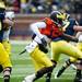 Quarterback Devin Gardner hands off the ball during the Michigan spring football game on Saturday, April 13. AnnArbor.com I Daniel Brenner